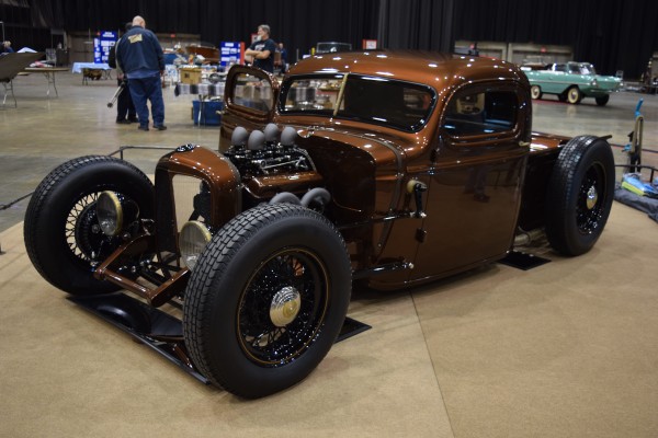 lowered ford hot rod truck at indoor car show