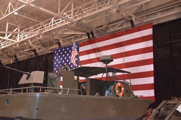 military gunboat at car show indoors