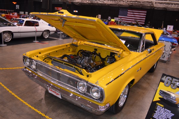 custom 1965 dodge muscle car at indoor car show