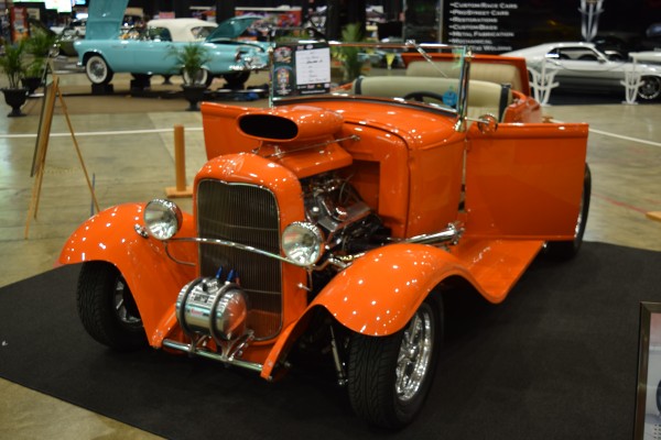 vintage ford roadster at indoor car show