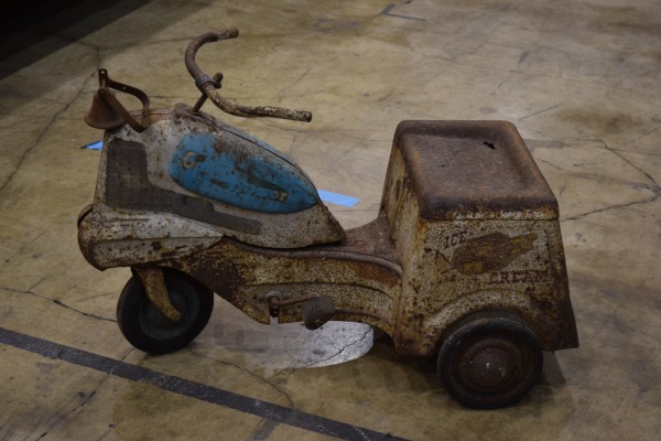 vintage kids pedal car scooter at indoor car show