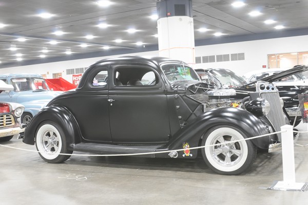 vintage ford five window coupe at indoor car show