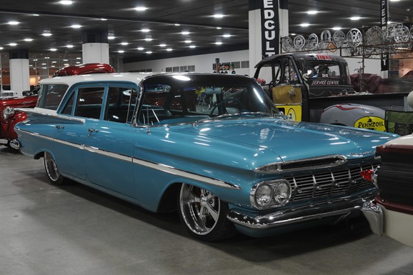 vintage chevy impala wagon at indoor car show
