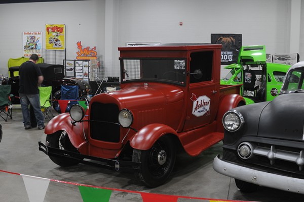 red vintage ford truck at indoor car show