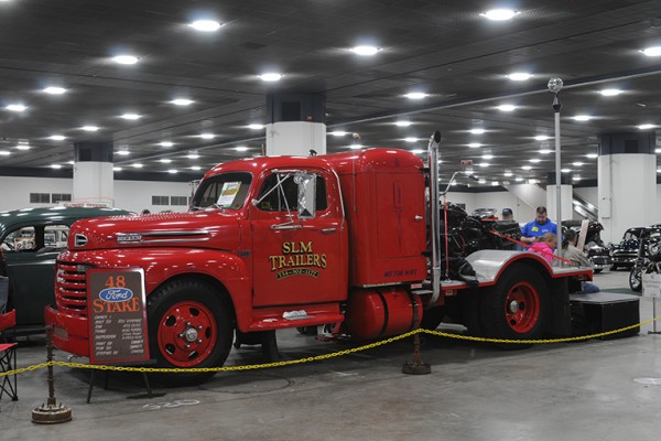 vintage ford semi truck at indoor car show