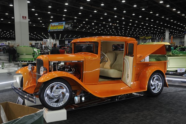 orange hotrod truck at indoor car show
