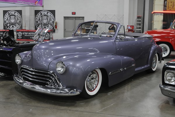 custom convertible coupe at indoor car show