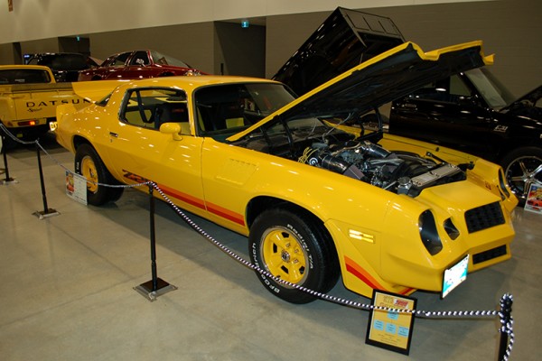 yellow chevy camaro z20 second gen at indoor car show