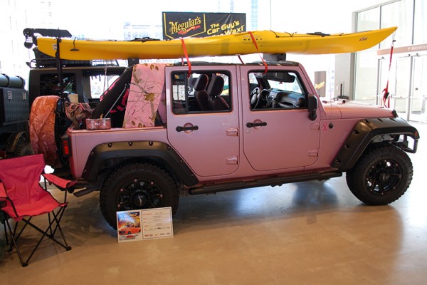 pink jeep wrangler jk with kayak on roof rack