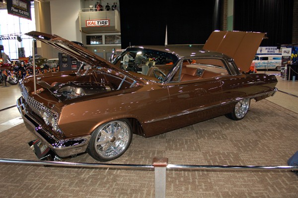 custom chevy impala at indoor car show