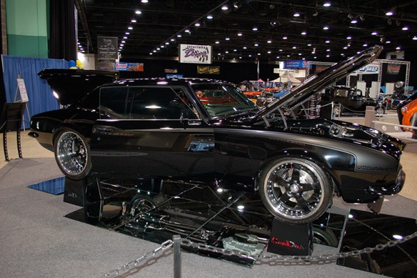 black custom muscle car at indoor car show