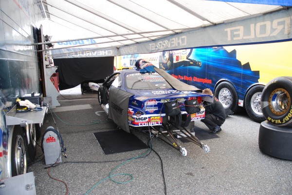 traction bars on a drag race car in pits