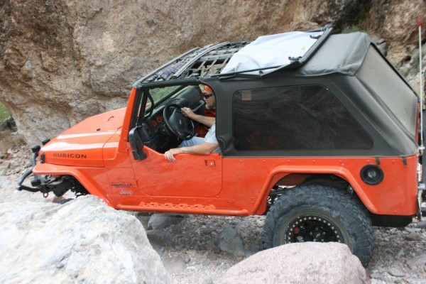 jeep wrangler tj going down a desert trail