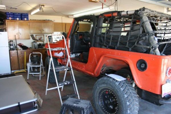 a jeep wrangler in a garage