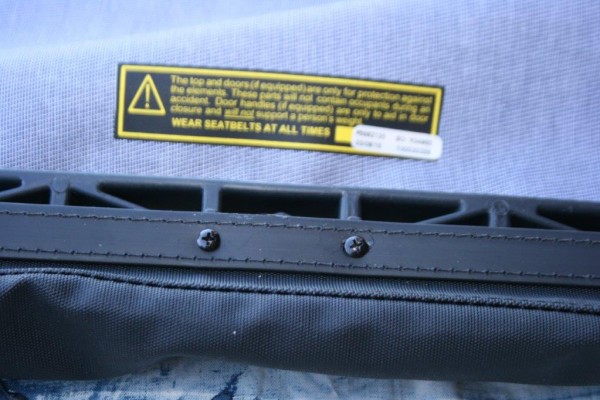 warning label on a jeep soft top
