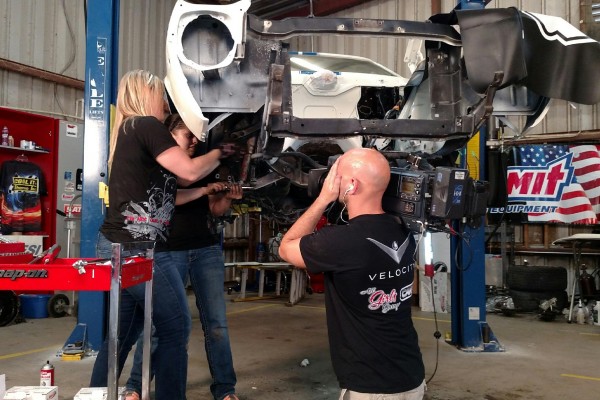 mechanics working on an AMC AMX in tv studio