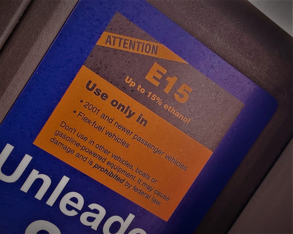stylized close up of ethanol e15 sticker on a gas pump