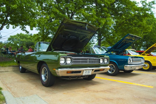 Row of classic mopar muscle cars at car show