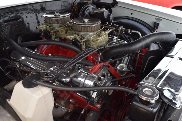 dual quad carburetor setup on a chevy v8 engine