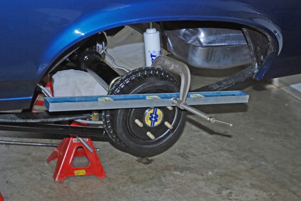 a framing level bolted to a wheel drum brake