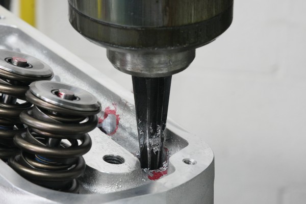 drilling larger pushrod holes into a cylinder head