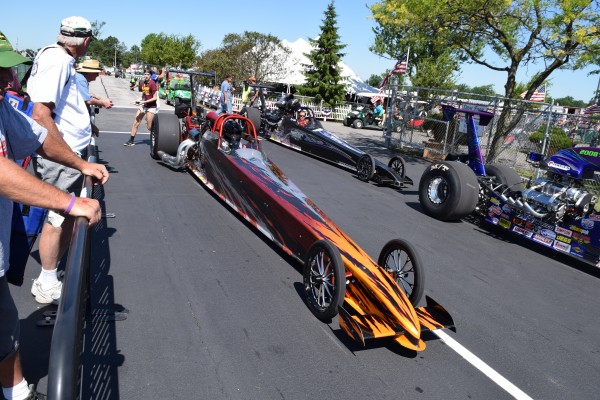 row of dragsters at nhra event