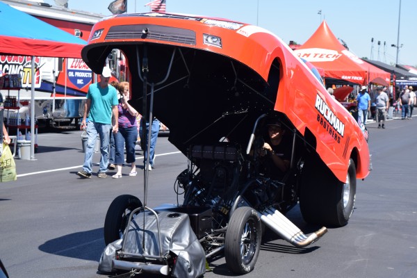 nhra funny car being towed to staging lanes