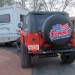 jeep being towed behind an rv camper thumbnail