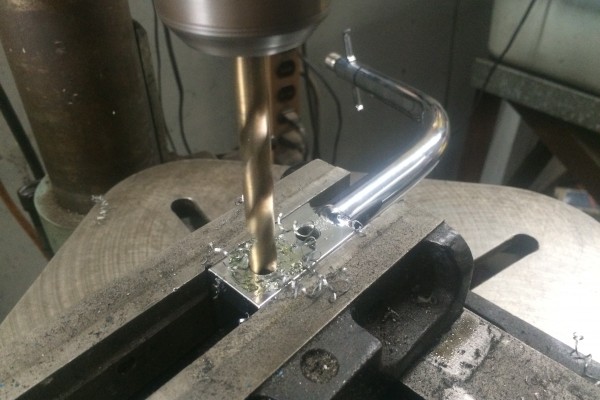 drilling holes into a mount for a shift lever