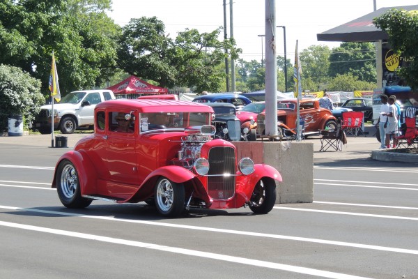 red hotrod coupe in parking lot