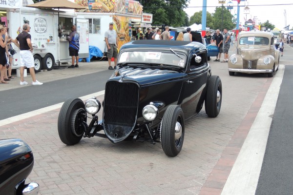 ford black hotrod in parade
