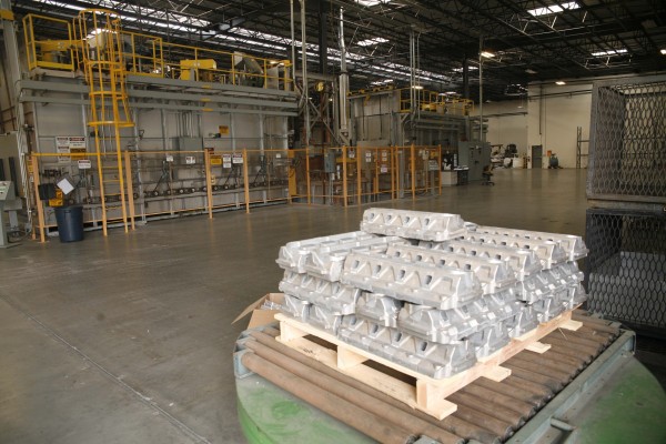 pile of cylinder head on a pallet in a factory