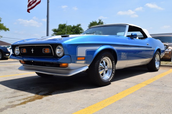 low profile view of a blue 1972 ford mustang mach 1 convertible