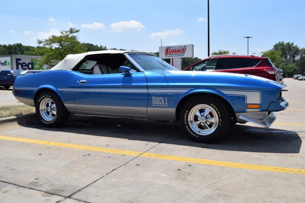 side view of a blue 1972 ford mustang mach 1 convertible
