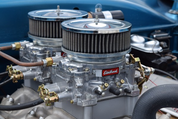 close up of a pair of carburetors on a 1952 ford gasser