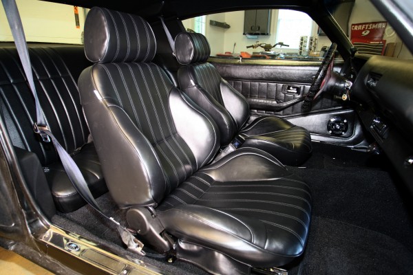 interior of a chevy musclecar with procar seats