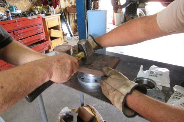 hammering in a bearing seal into a hub assembly