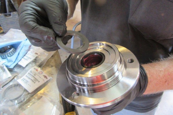 fitting a bearing washer onto a hub assembly