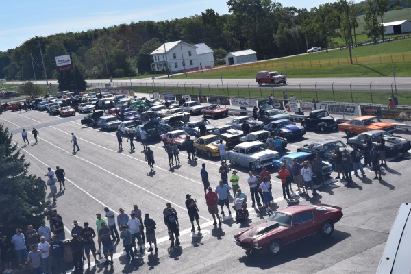 aerial view of cars staging at a dragstrip for drag week