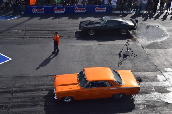 overhead view of a camaro and chevy 11 nova staging at a dragstrip
