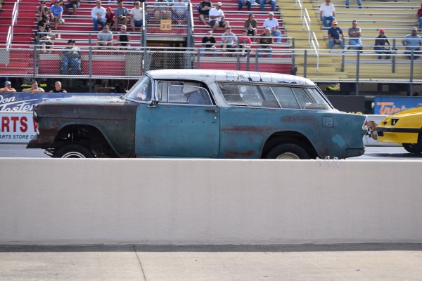 1955 chevy nomad wagon launching at a dragstrip