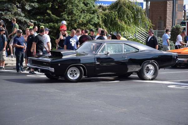 1968 dodge charger with hood scoop in staging lanes at a drag stirp