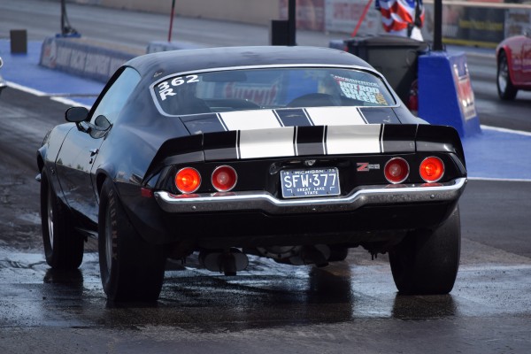 rear view of a 1973 chevy camaro z28 launching at drag strip
