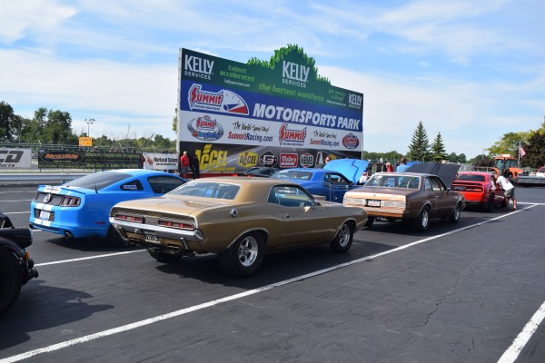 row of cars in staging lanes of summit motorsports park drag race track
