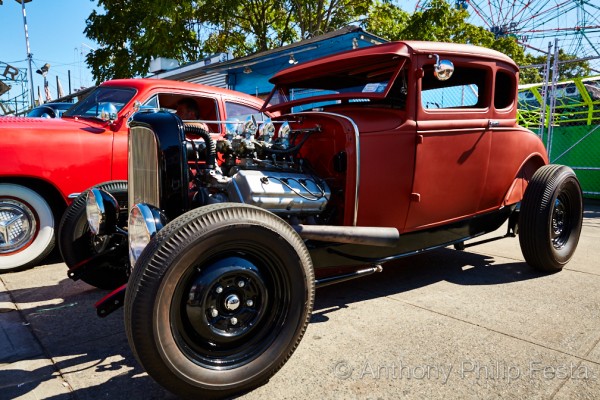 ford hotrod with a hemi engine at a car show
