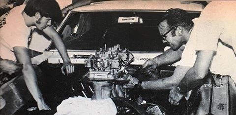 vintage photo of bill jenkins working on chevy camaro engine