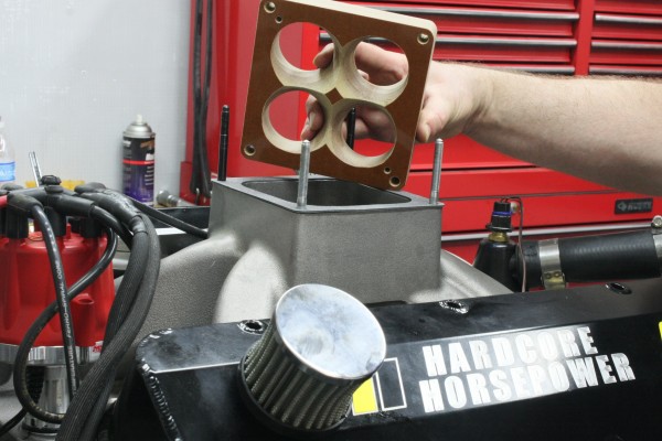 installing carburetor spacer on an intake manifold