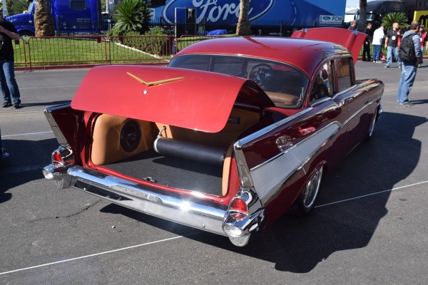 rear view of a custom 1957 chevy bel air with trunk open