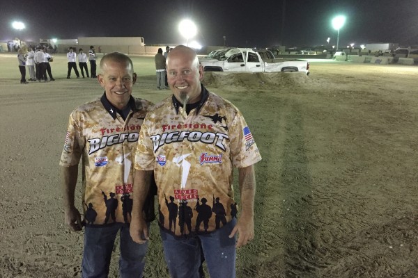 bigfoot monster truck drivers pose after crushing cars