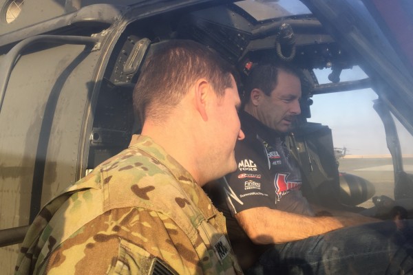 greg anderson touring military helicopter cockpit